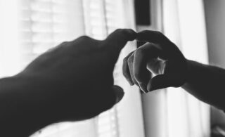 black and white index finger in mirror