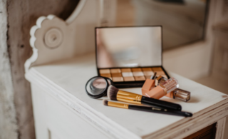 some makeup on a dressing table