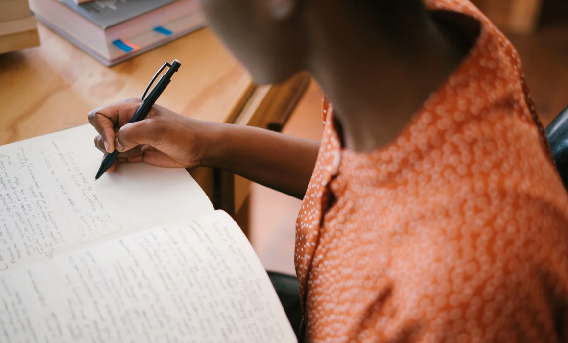 Woman writing in a notebook