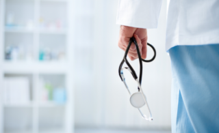 A doctor holding a stethoscope